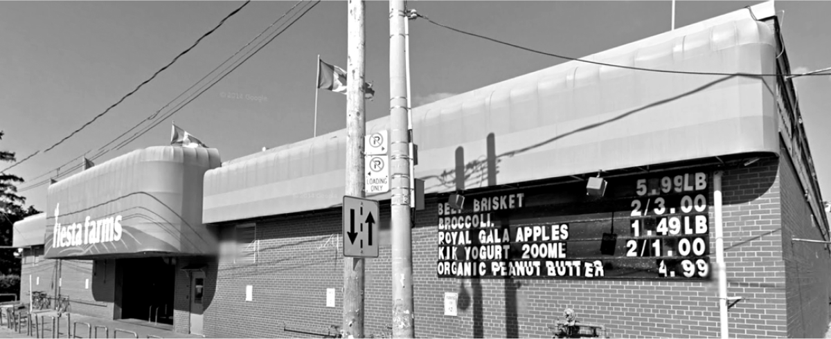 Black and white photo of the front entrance to Fiesta Farms